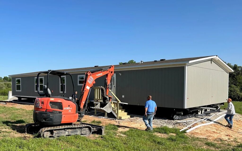 Mobile home being set up on its new lot